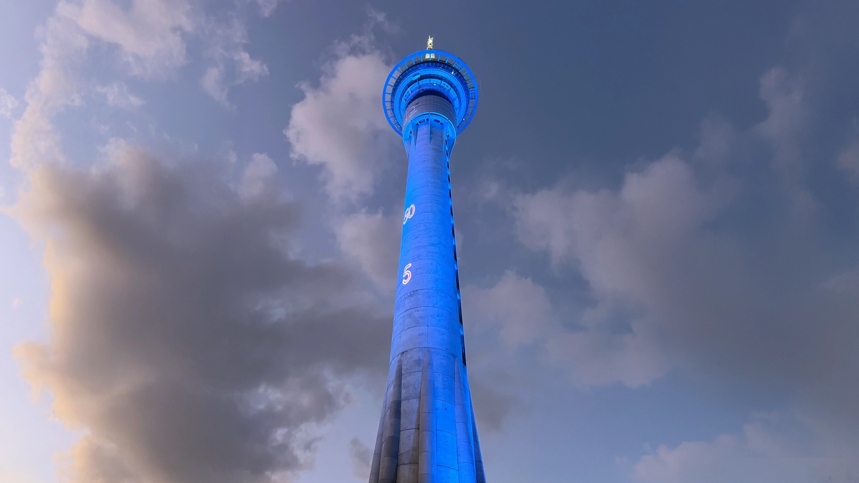 PlayStation Sky Tower projection display at sunset — Auckland