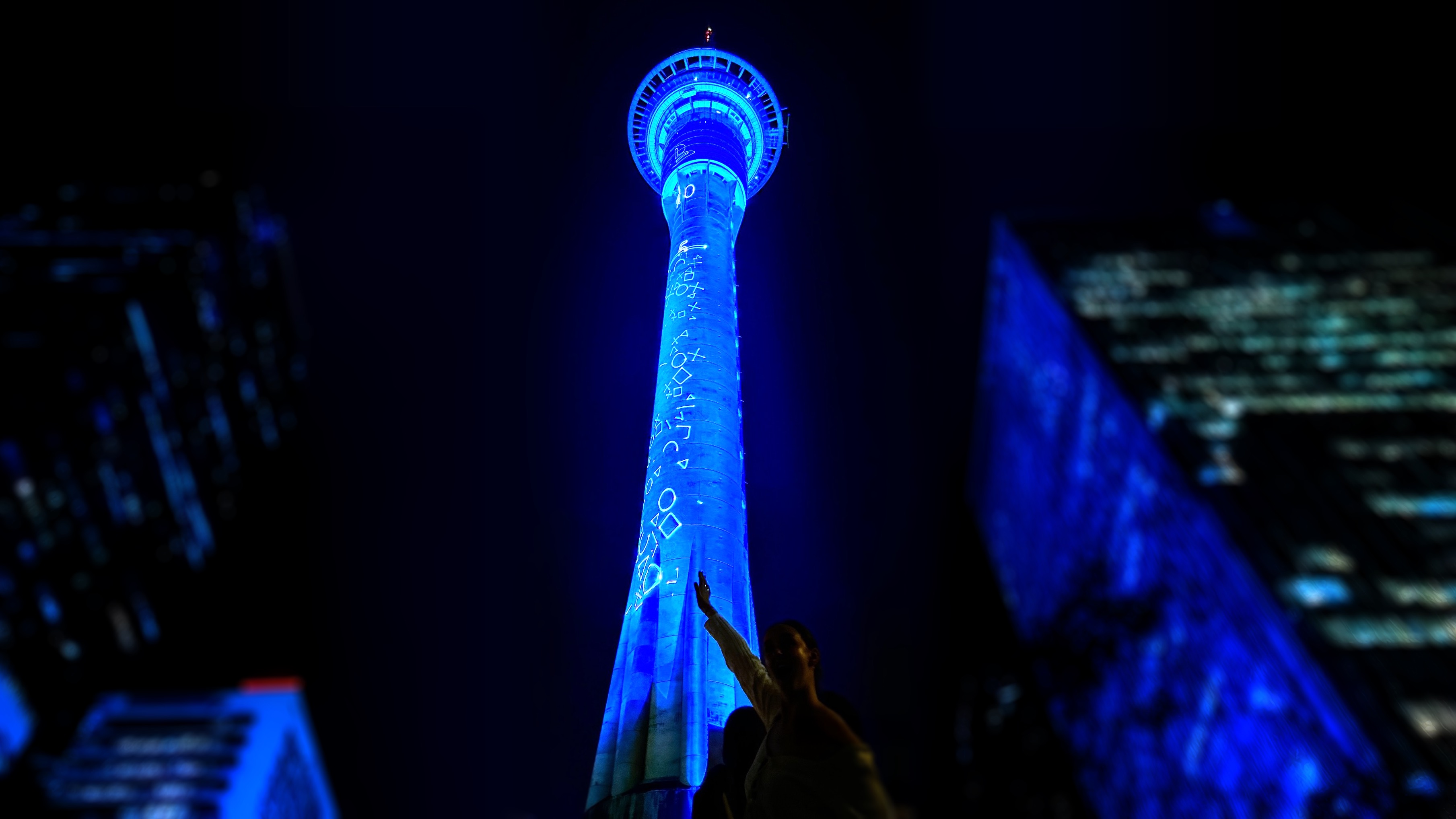 PlayStation Sky Tower projection display at night — Auckland