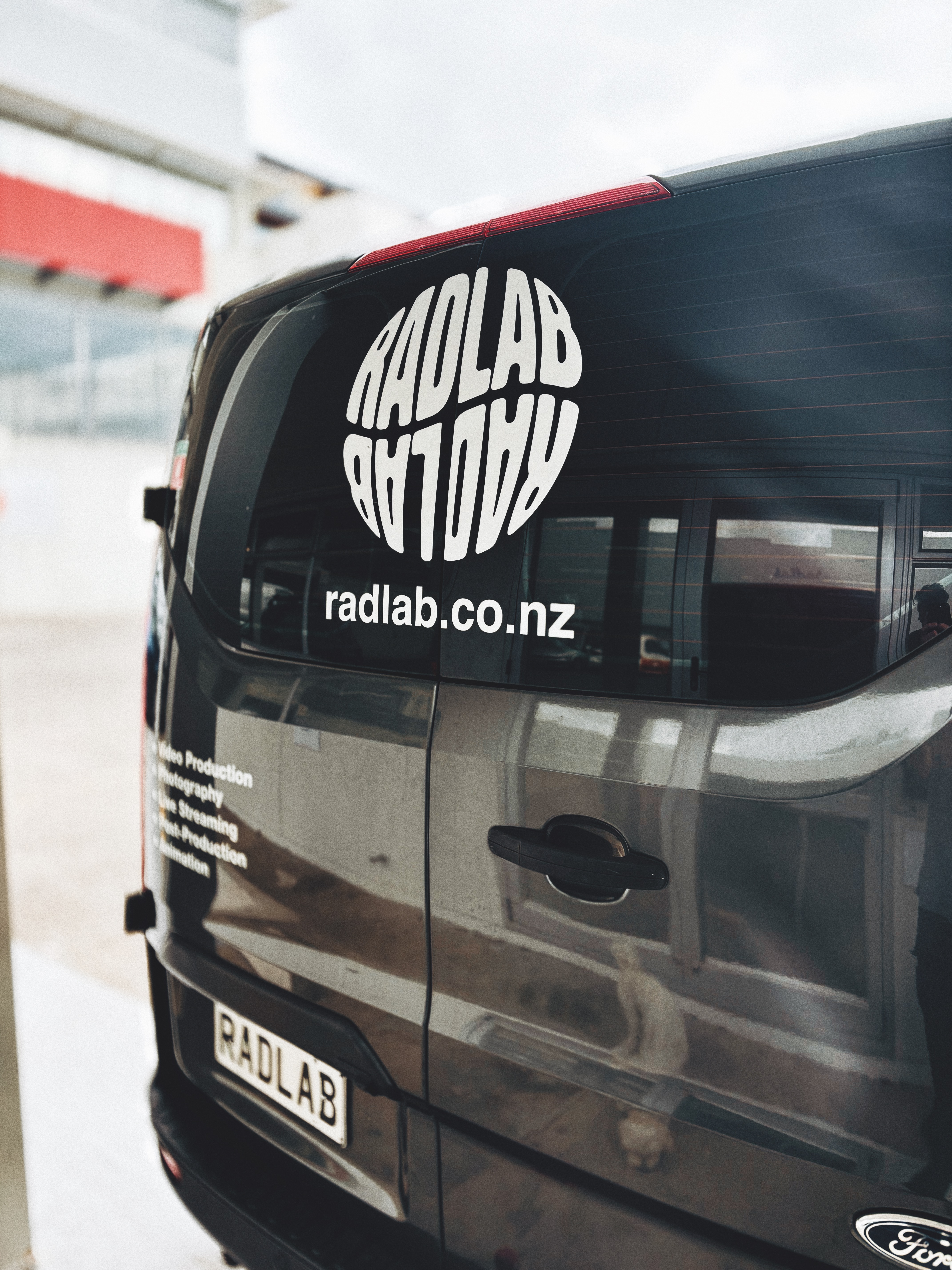 Radlab vehicle signage — custom typography on company van